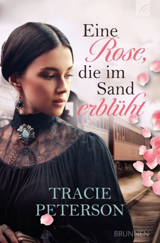 Eine Rose, die im Sand erblüht